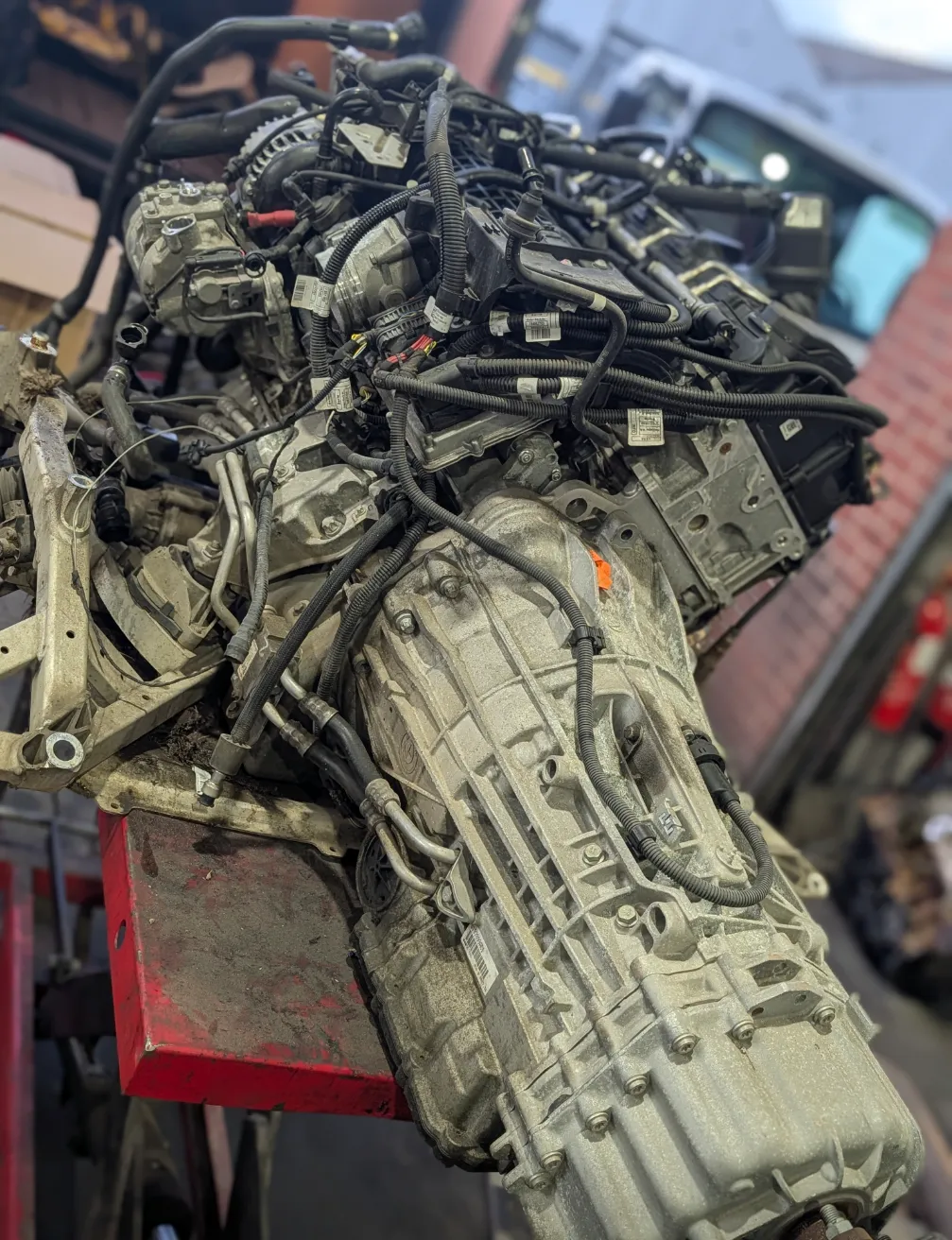 Complete engine and gearbox assembly on engine stand