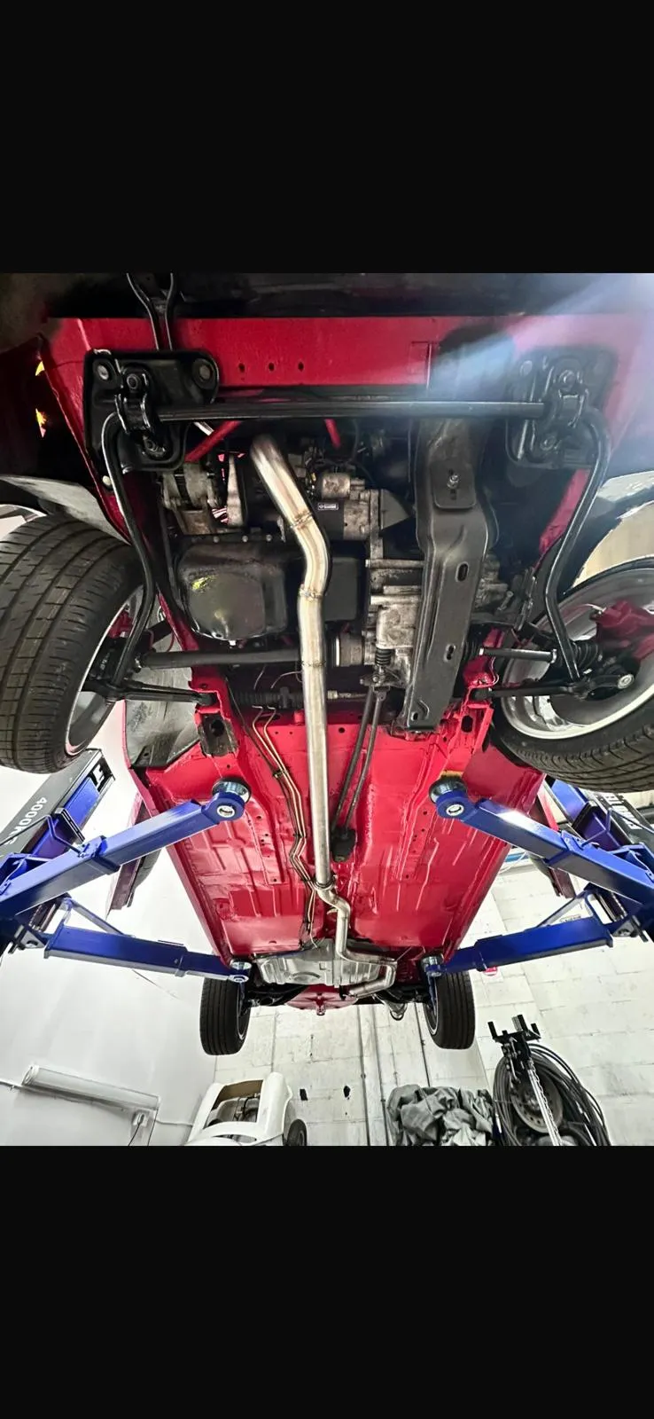 Custom exhaust fitted to car on lift